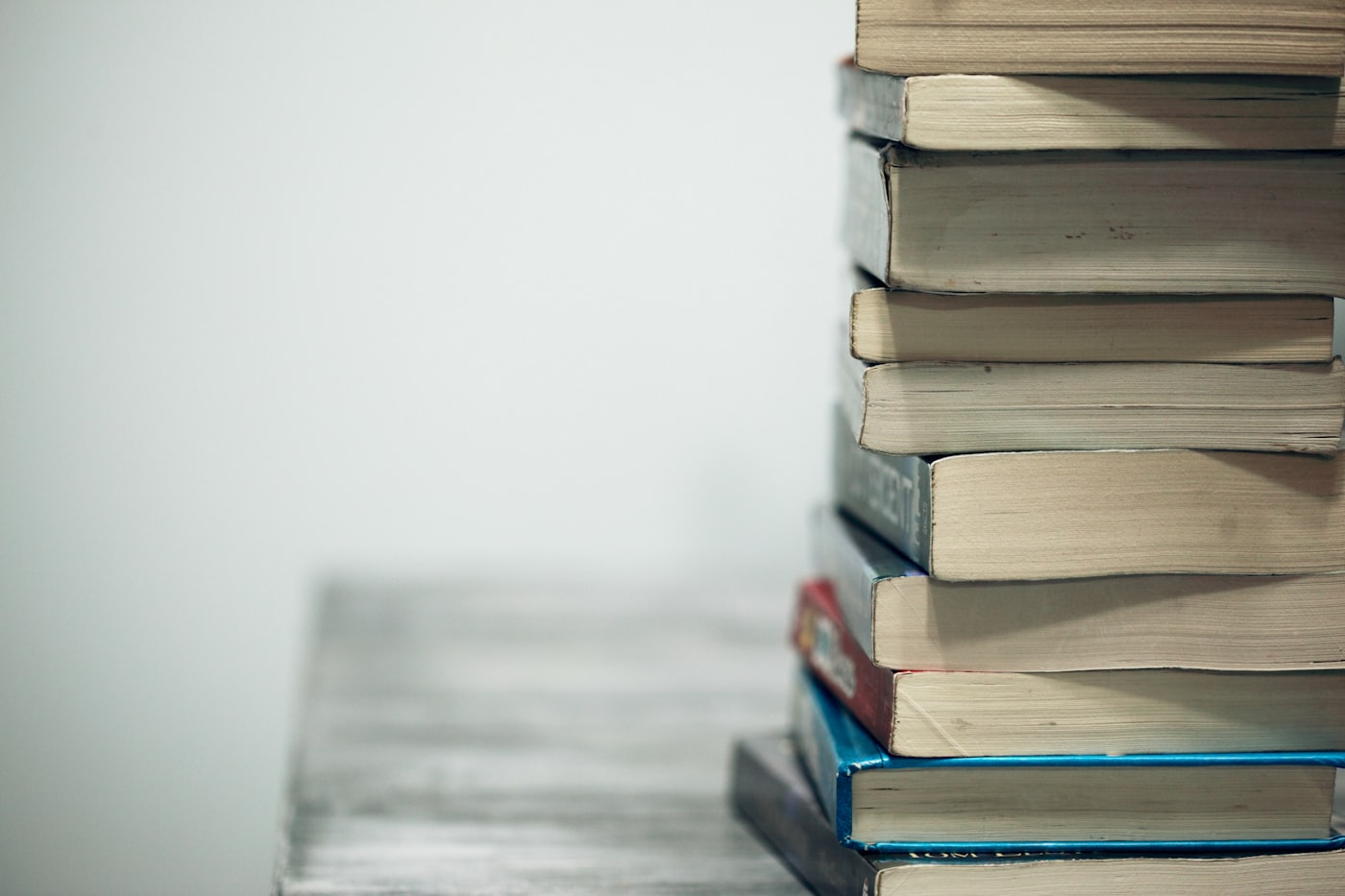 Stack of books, clean grey background